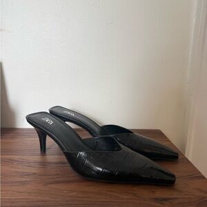 Black leather mules with low heel